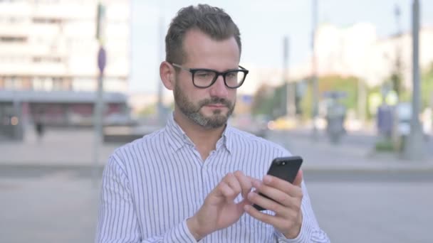Adult Man Celebrating Online Success Smartphone Outdoor — Stockvideo