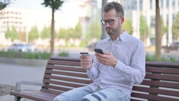 Adult Man Shopping Online While Sitting Outdoor Bench — Stock Video
