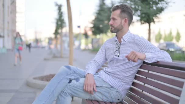 Adult Man Smiling Camera While Sitting Bench — Stockvideo