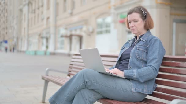 Rejecting Senior Old Woman Denial While Using Laptop Sitting Outdoor — Video