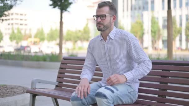 Adult Man Having Back Pain While Sitting Bench Outdoor — Stockvideo