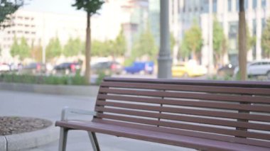 Adult Man Coming, Sitting on Bench and Opening Laptop