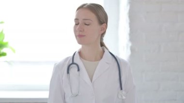Female Doctor Shaking Head in Denial 