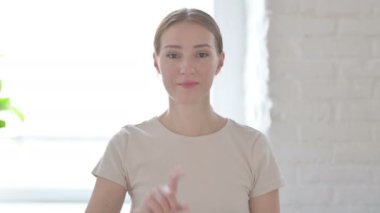 Young Woman Showing No Sign by Finger, Denial 