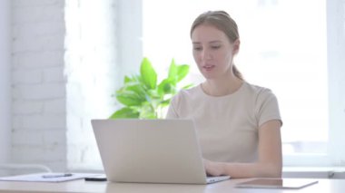 Young Woman Cheering Online Win in Office
