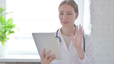 Online Video Call on Tablet by Female Doctor