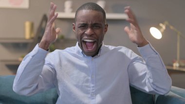 The Portrait of Young African Man Shouting, Screaming
