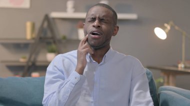 The Portrait of Sick Young African Man having Toothache