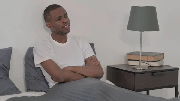 Young African Man Sitting Bed — Stock fotografie