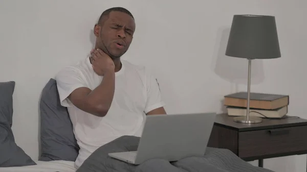 Young African Man Laptop Having Neck Pain Bed — Fotografia de Stock