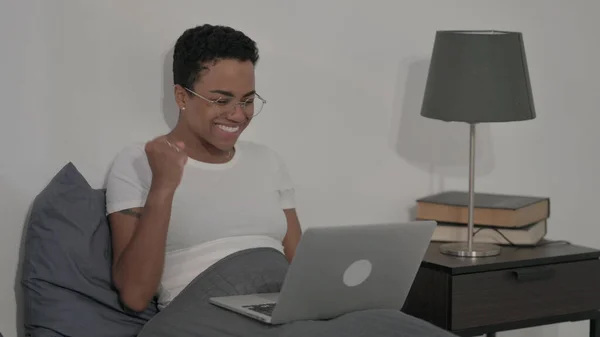 Young African Woman Celebrating Success Laptop Bed — Fotografia de Stock