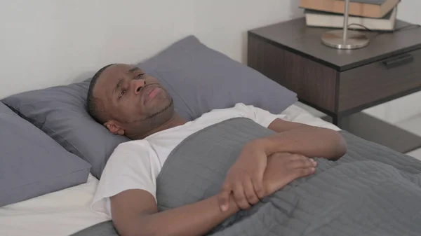 Young African Man Laying Bed Unable Sleep — Zdjęcie stockowe
