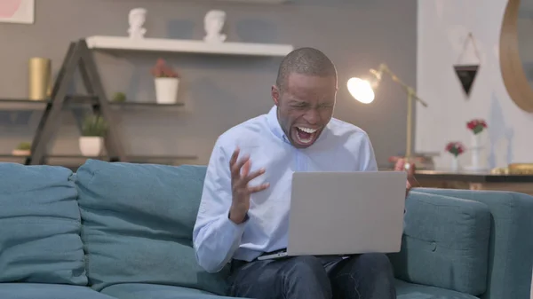 Young African Man Feeling Shocked While Using Laptop — Stockfoto