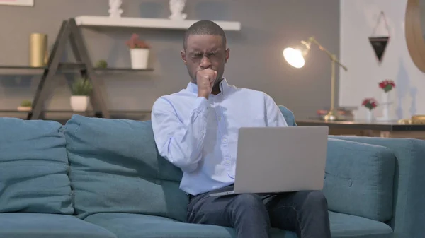 Young African Man Laptop Coughing Sofa —  Fotos de Stock