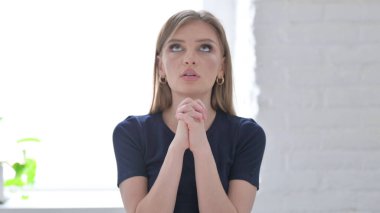 Man Praying to God for Help with Closed Hands