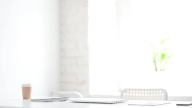 Closed Laptop on Desk in Loft Office