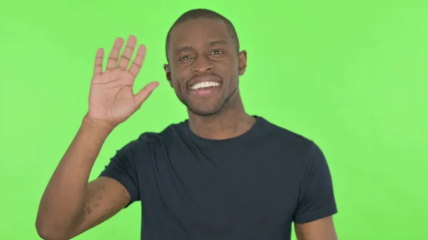 African Man Waving Welcoming Green Background — Stock Photo, Image