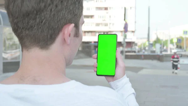 Casual Man Using Smartphone Green Screen Outdoor — Stockfoto