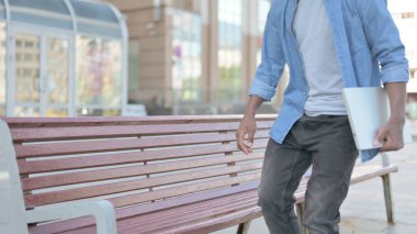 African Man Coming, Sitting on Bench and Opening Laptop