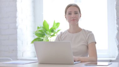 Shaking Head in Rejection, Denial by Young Woman Working on Laptop