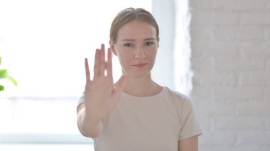 Denying Young Woman Asking to Stop with Hand Gesture