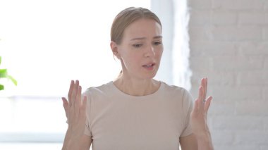 Distraught Young Woman Talking in Anger and Stress