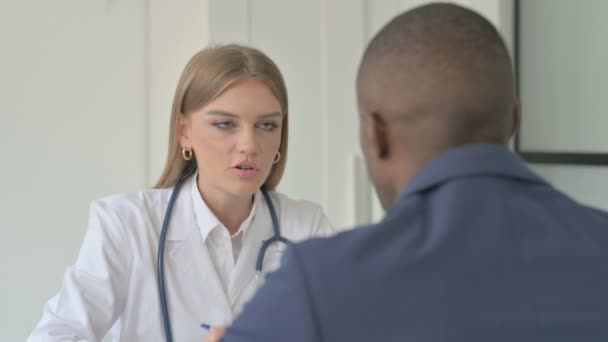 Female Doctor Talking African American Man Patient — Stock Video