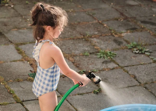 Cute Gril Bathing Suit Playing Water Hose Warm Afternoon — Stock Photo, Image