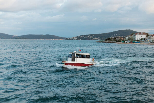 national turkish flag on boat sailing in blue sea in turkey 