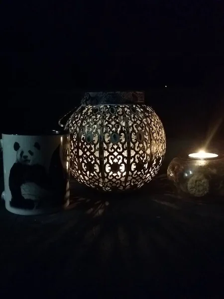 beautiful outdoor decoration with candle on black background