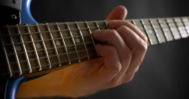 Close-up of the musicians fingers on the guitar neck. — Stock Video