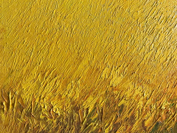 Soyut sanat arka planı koyu altın renkler. Sarı fırça darbeleriyle tuval üzerinde suluboya boya. Okher desenli kağıt üzerinde bir sanat eseri. Doku arkaplanı, makro.