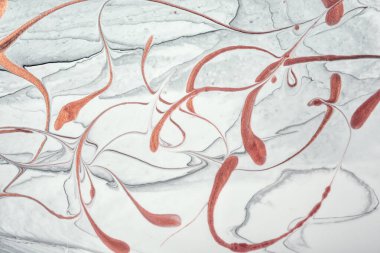 Abstract fluid art background light gray and red glitter colors. Liquid marble. Acrylic painting on canvas with white gradient and splash. Watercolor backdrop with waves pattern.