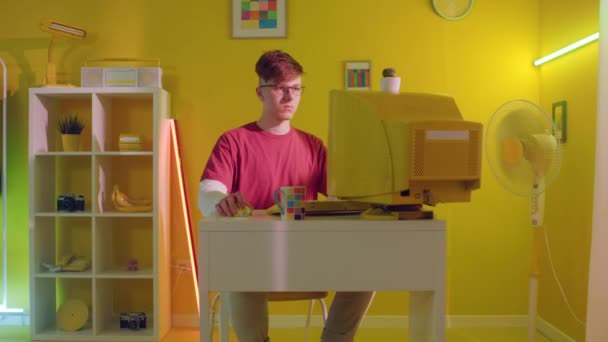 Young Man Is Sitting At Workplace and Scrolling Computer Mouse — Stock Video