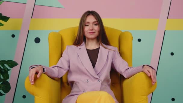 Bossy Woman Is Sitting In Yellow Armchair — Stock video