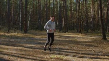 Man Practices Butt Kick Running