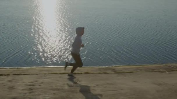 Man Runner Is Training Near Lake — Stock Video