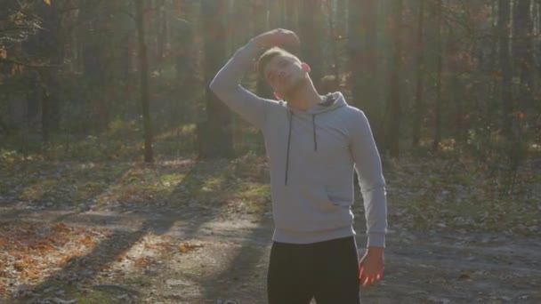 Man Is Stretching In Forest Before Morning Workout — Stock Video
