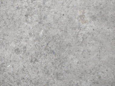 Evin önündeki asfalt alan yüzeyinin soyut arkaplanı, yüksek açıyla çekilmiş.