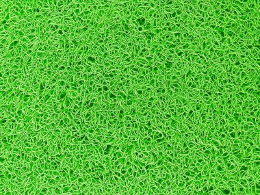 Yüksek açılı yeşil kauçuk kapı paspasının soyut arkaplanı