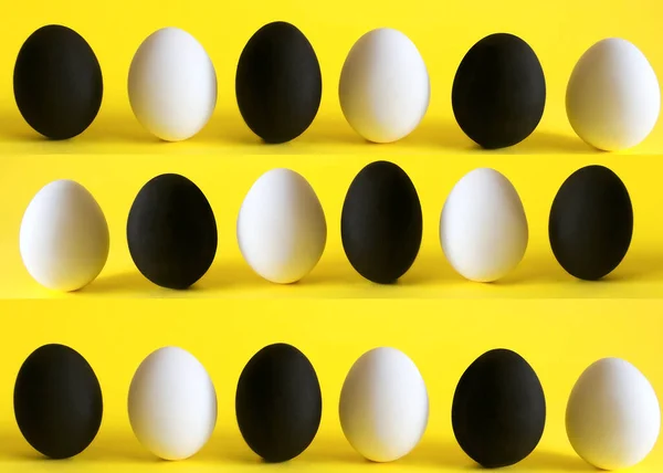 Huevos Blancos Negros Sobre Fondo Amarillo — Foto de Stock