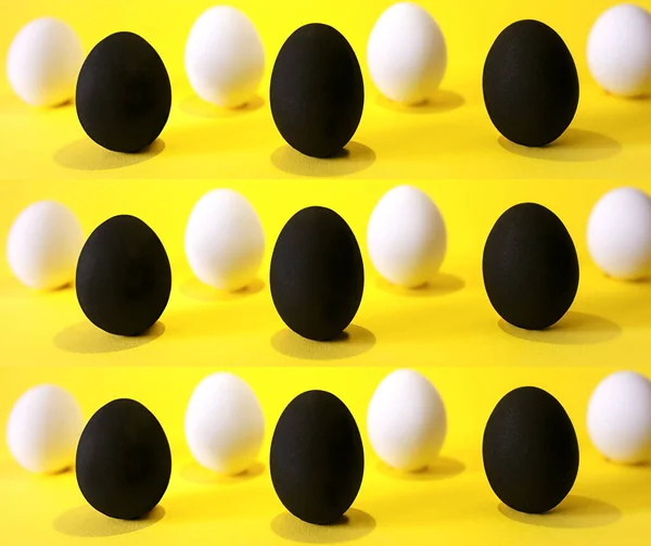 Huevos Blancos Negros Sobre Fondo Amarillo — Foto de Stock