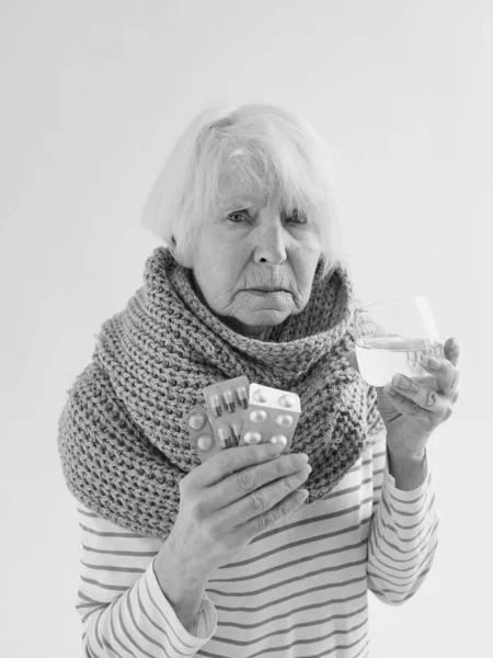 Senior Ill Woman Glass Water Peels Scarf Freezing White Background — Stock Photo, Image