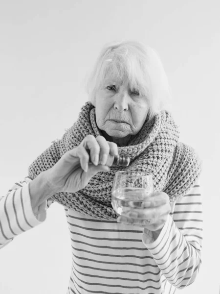 Senior Ill Woman Scarf Freezing Cold Put Drops Glass Water — Stock Photo, Image