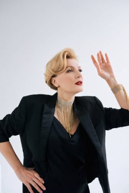 fashionable stylish beautiful mature woman in tuxedo. 