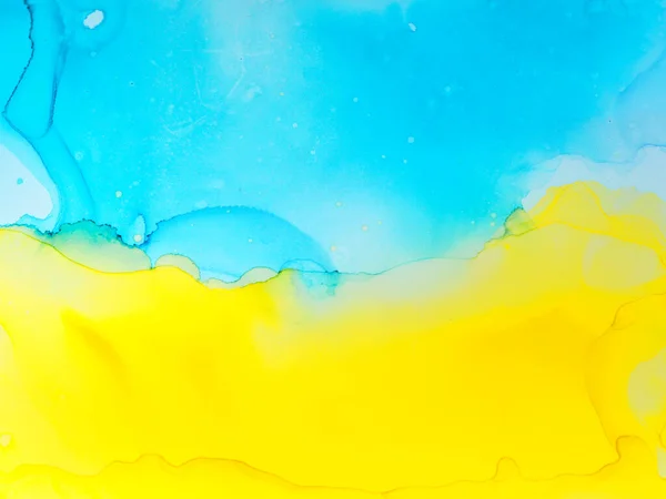 Abstract blue and yellow fragment of colorful background, wallpaper. Mixing acrylic paints. Modern art. Marble texture. Alcohol ink colors translucent. Alcohol Abstract contemporary art fluid.