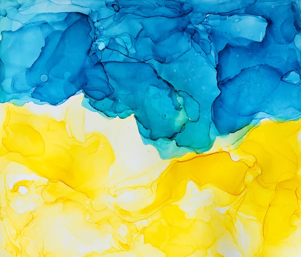 Abstract blue and yellow fragment of colourful background, wallpaper. Mixing acrylic paints. Modern art. Marble texture. Alcohol ink colours translucent. Alcohol Abstract contemporary art fluid.