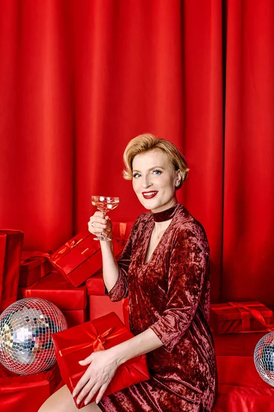 Mature Stylish Elegant Woman Glass Sparkling Wine Present Red Background —  Fotos de Stock