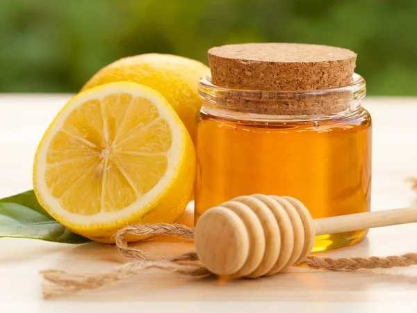 Honey and Lemon with nature background , The best natural cold and flu remedies