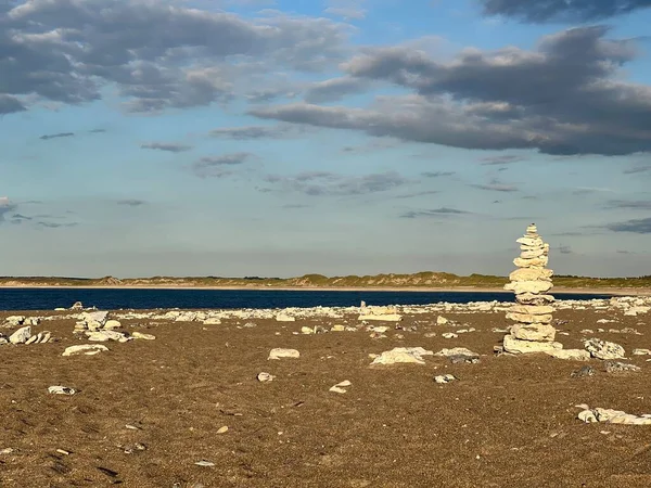 concept of balance and harmony. rocks on the coast of the Sea, Balanced stones on a pebble beach during sunset, landscape with sea shore, rocks in water and sand, Baltic Sea, rocks on the coast